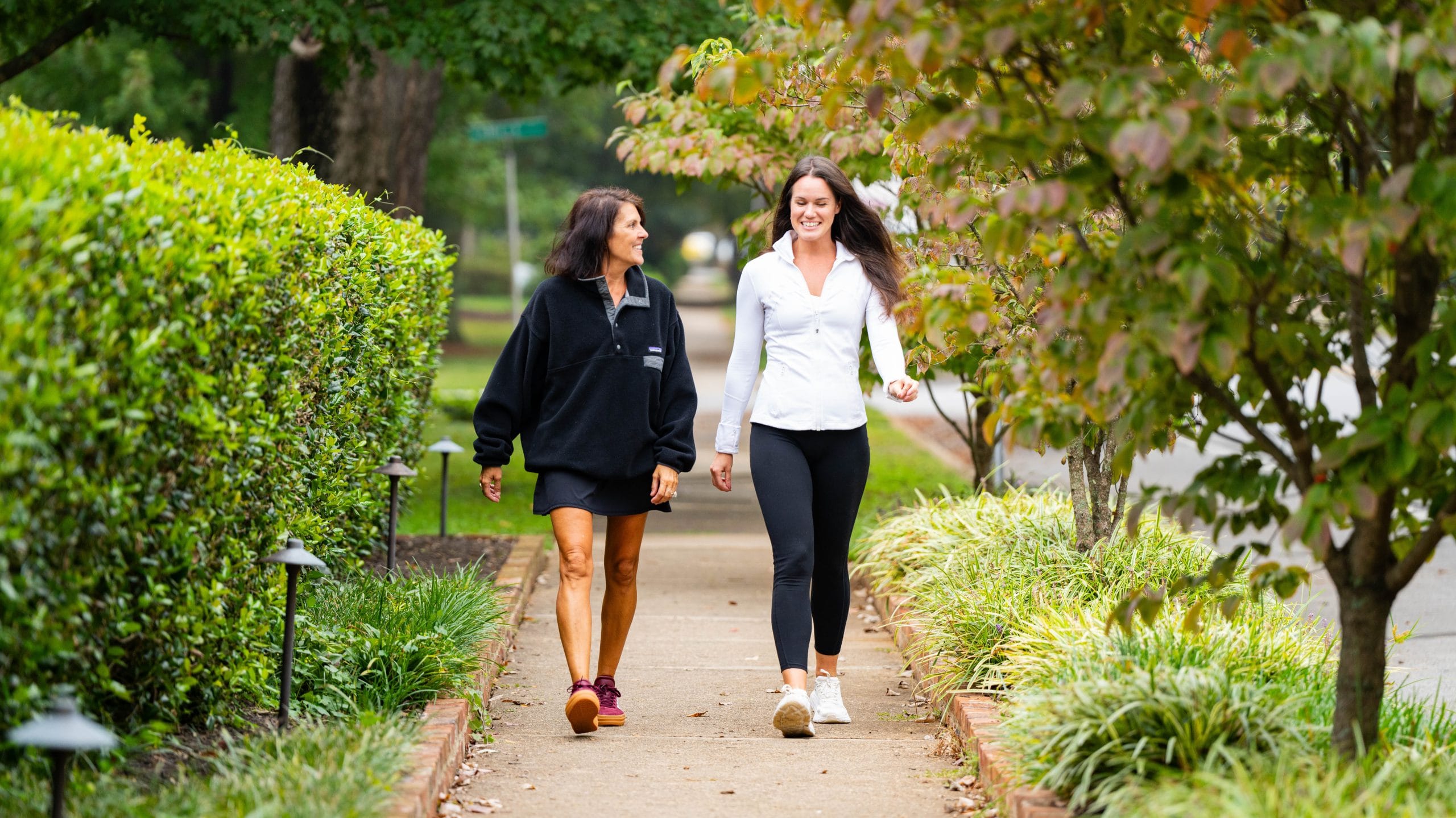 2 woman on a walk outside